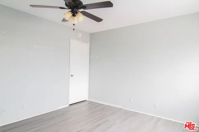 a view of a chandelier fan in a room
