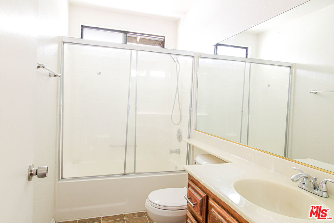 45809 Evelyn Court Lancaster, CA 93534 - Photo 17 of 24 a bathroom with a sink a toilet and shower