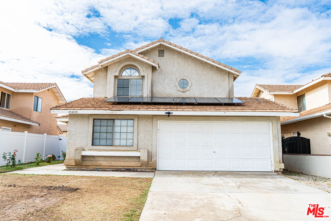 45809 Evelyn Court Lancaster, CA 93534 - Photo 2 of 24 a view of a house with a wooden fence