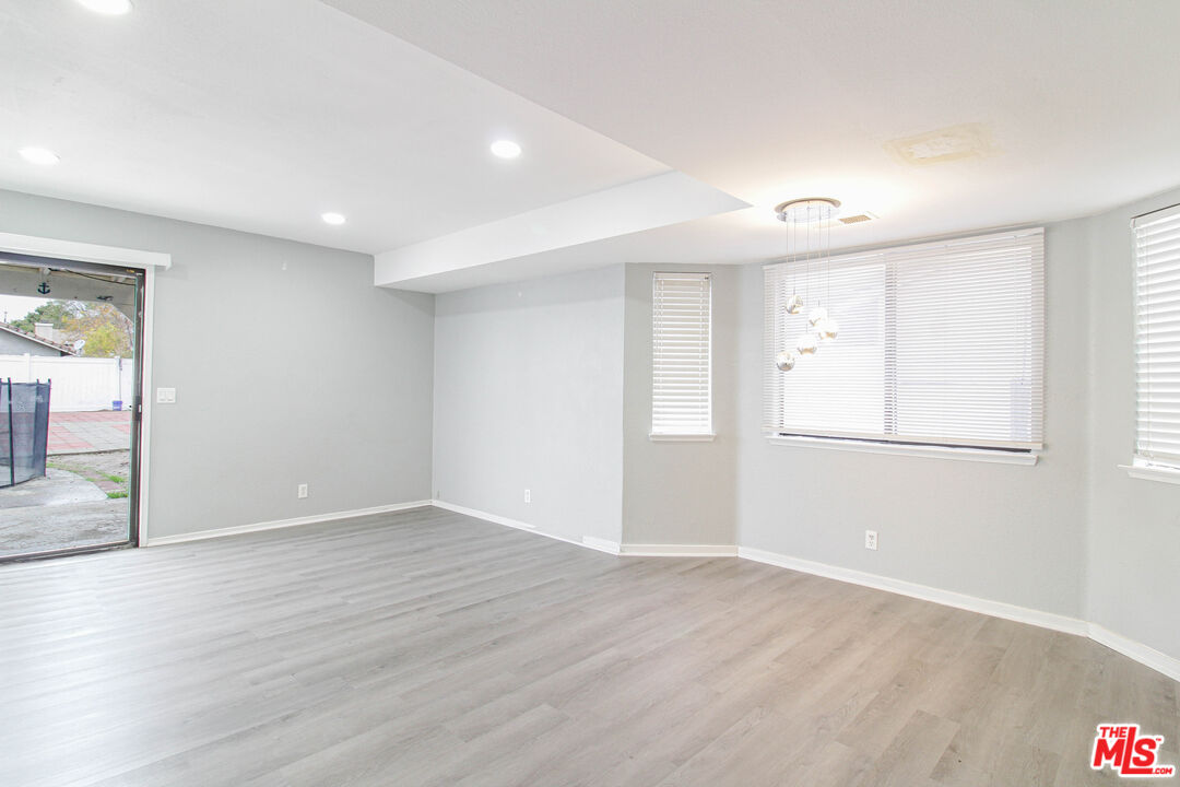 45809 Evelyn Court Lancaster, CA 93534 - Photo 6 of 24 a view of an empty room with wooden floor