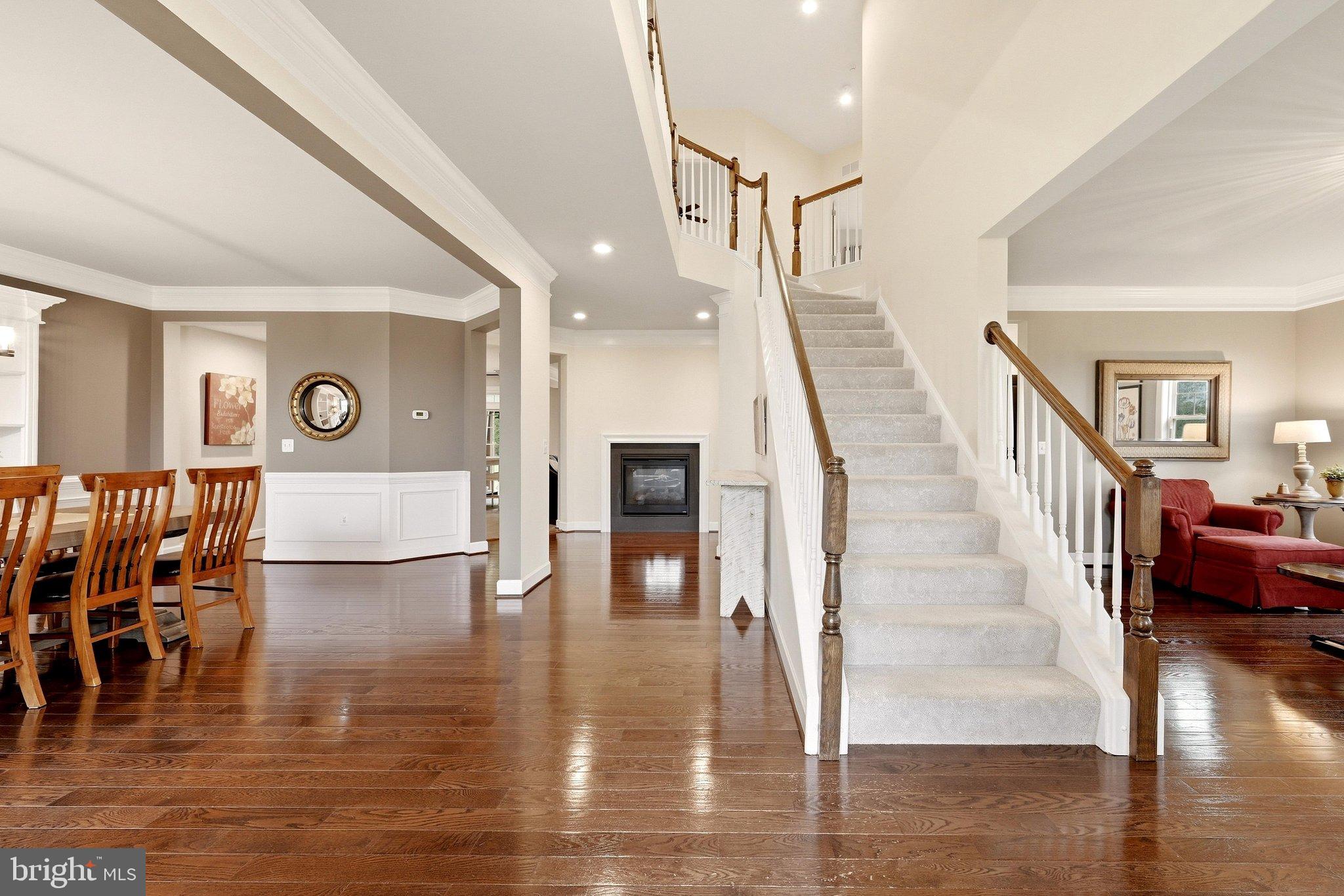 Two-story foyer with hardwood floors