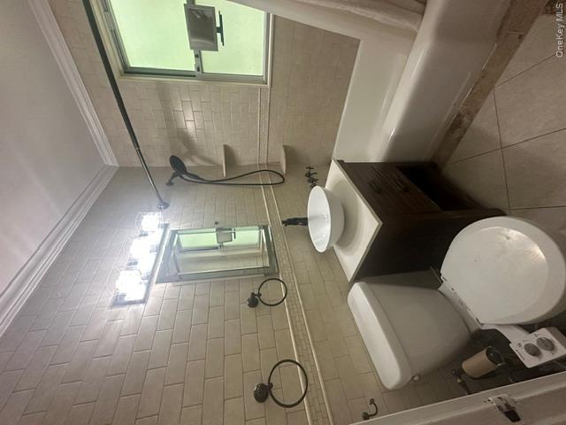 9 Stokes Road, Unit 2B Yonkers, NY 10710 - Photo 2 of 19 crown molding, granite counter and ceramic tile floor