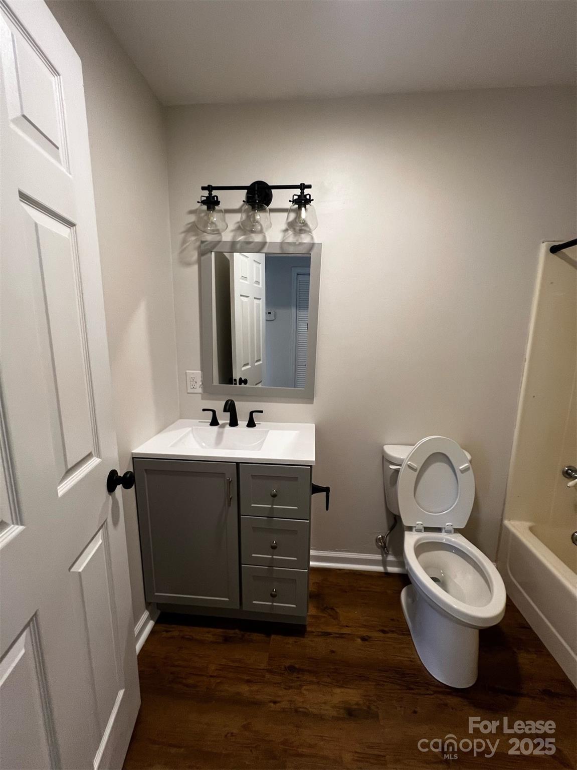 120 South Morrow Avenue Albemarle, NC 28001 - Photo 6 of 6 a bathroom with a toilet sink and mirror