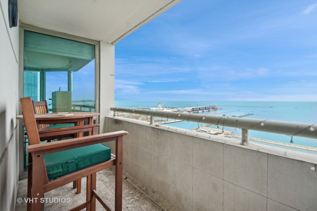 a view of a outdoor kitchen with a ocean view