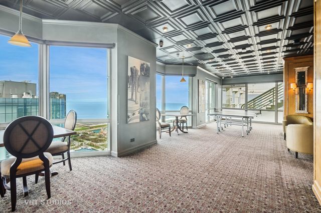 a view of a livingroom with furniture and a window