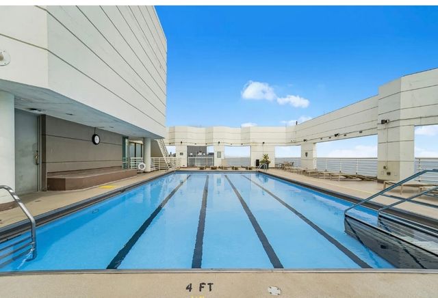 a kitchen with stainless steel appliances wooden cabinets and a counter top space