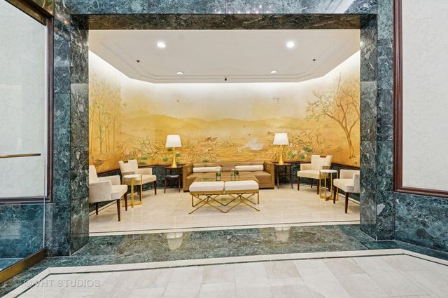 a view of a swimming pool and chairs