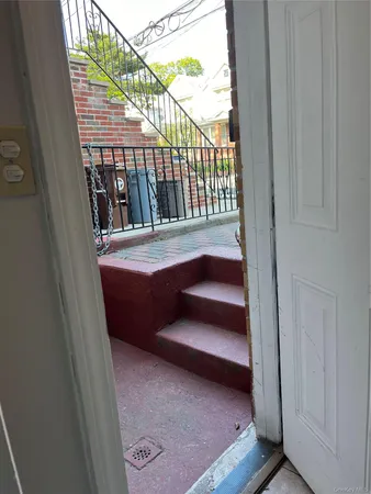 a view of balcony with furniture