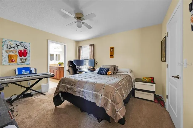 a bed room with a bed and a chandelier