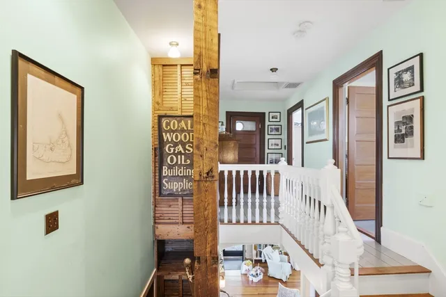 a view of a hallway with windows