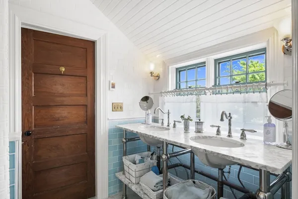 a kitchen with a sink cabinets and appliances