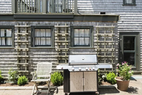 a building with potted plants in front of it