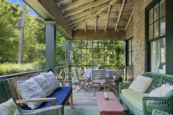 a outdoor living space with furniture and a potted plant