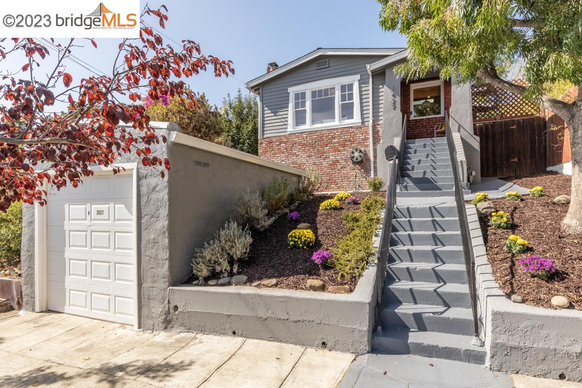 a view of a house with a potted plant in front of it