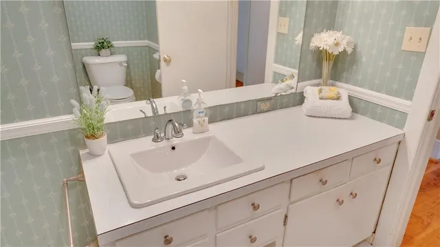 a bathroom with a sink and mirror