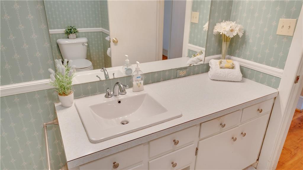 803 Forrest Avenue Tifton, GA 31794 - Photo 18 of 52 a bathroom with a sink and mirror