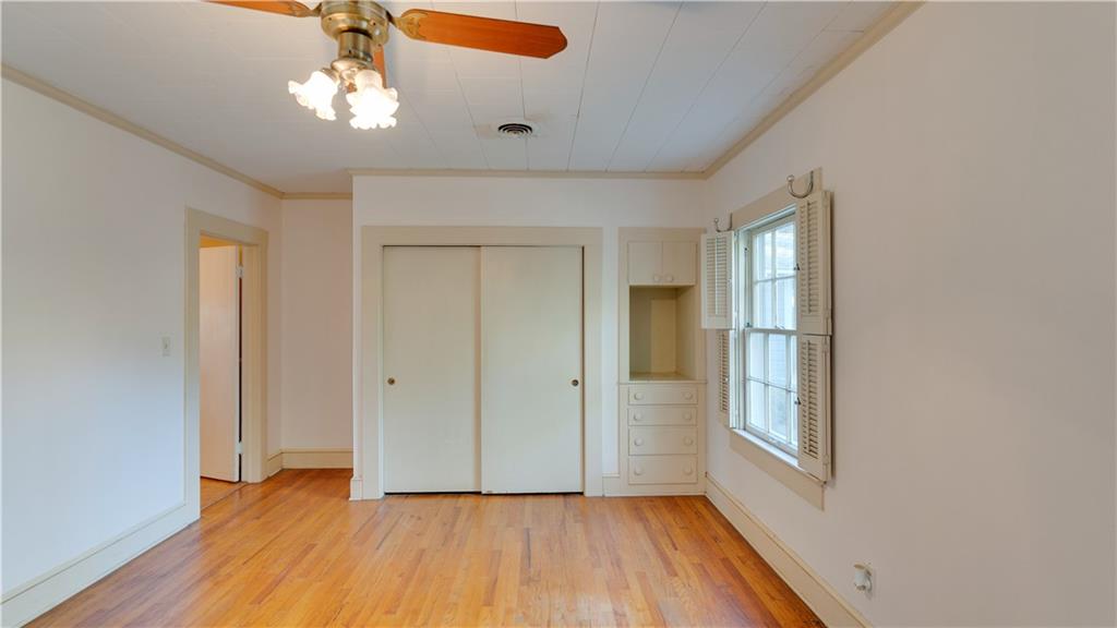 803 Forrest Avenue Tifton, GA 31794 - Photo 20 of 52 wooden floor in an empty room with a window