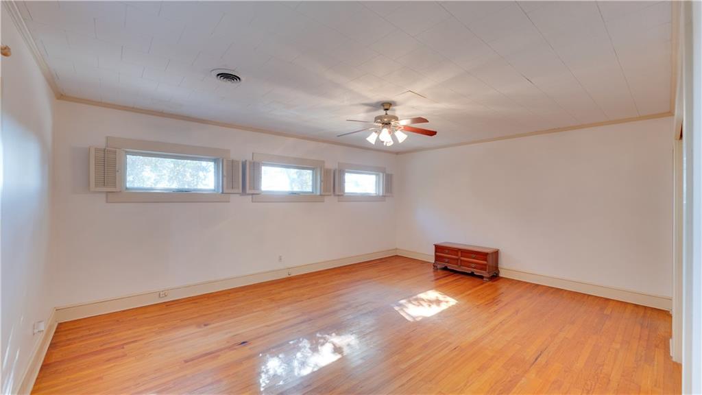 803 Forrest Avenue Tifton, GA 31794 - Photo 22 of 52 a view of a room with wooden floor and window