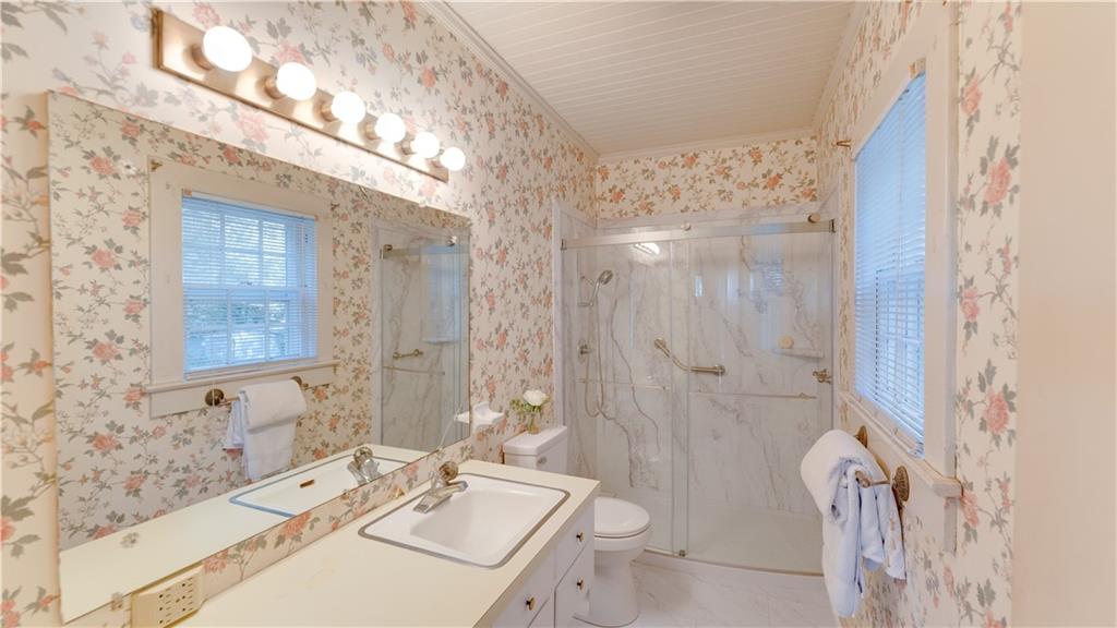 803 Forrest Avenue Tifton, GA 31794 - Photo 23 of 52 a bathroom with a sink a toilet a tub and shower