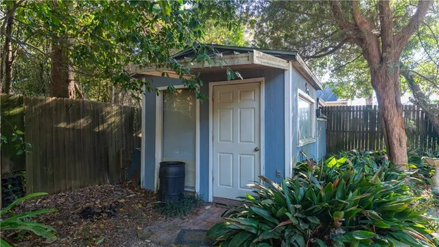a yellow house with a outdoor space