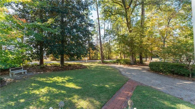 a view of a house with a tree