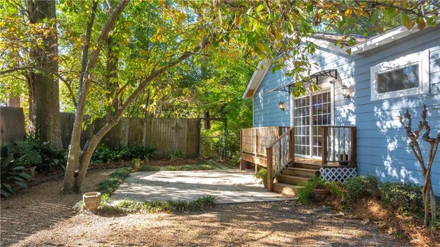 a backyard of a house with lots of green space