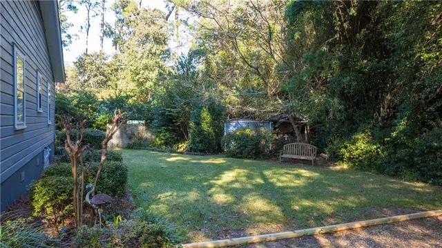 a view of a house with a tree in the background