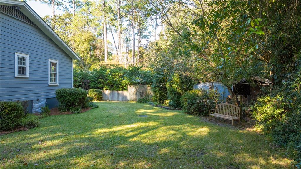 803 Forrest Avenue Tifton, GA 31794 - Photo 52 of 52 a backyard of a house with a garden and plants