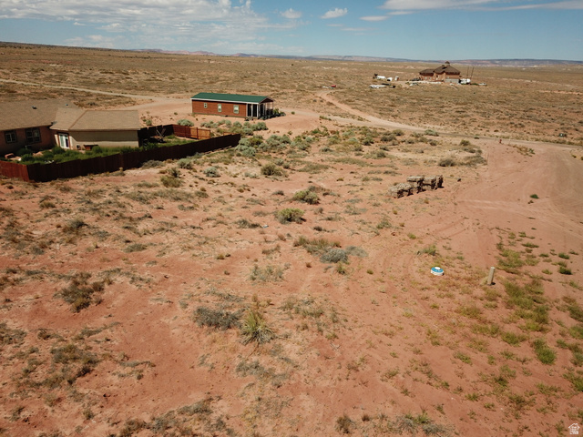113 5th Avenue, Unit 113 Kanab, UT 84741 - Photo 9 of 13 Expansive undeveloped lot featuring a natural desert landscape and distant structures