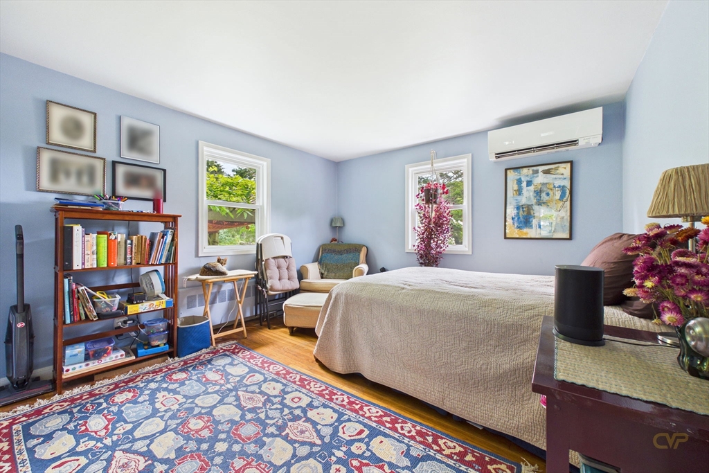 70 Neponset Street Canton, MA 02021 - Photo 21 of 39 a bedroom with a bed a dresser and a book shelf
