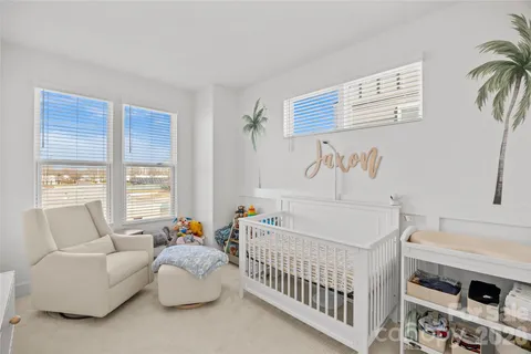a bedroom with furniture and a window