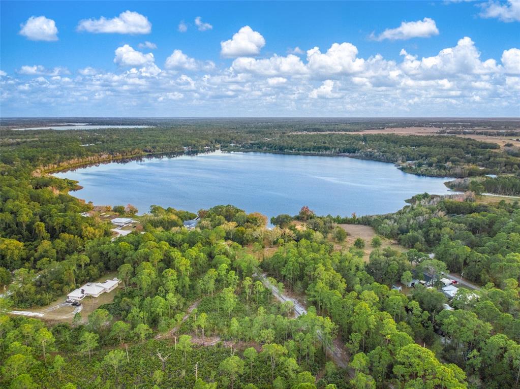 5817 Wolf Lake Road Sebring, FL 33875 - Photo 1 of 20 a view of a lake with a beach