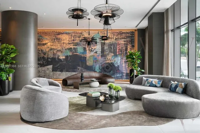 a living room with furniture and a large window