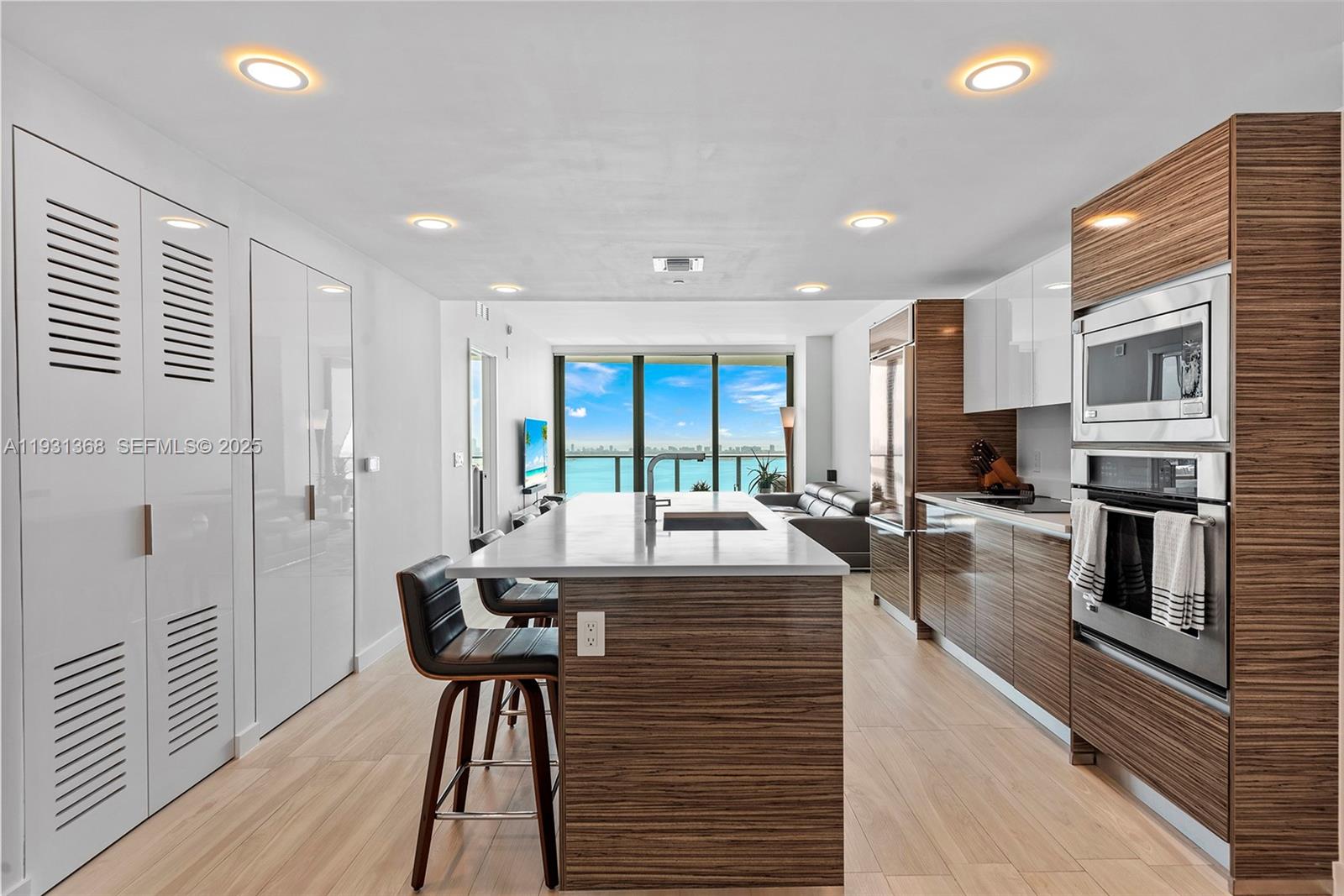 460 Northeast 28th Street, Unit 3903 Miami, FL 33137 - Photo 15 of 44 a view of a dining room with furniture window and wooden floor