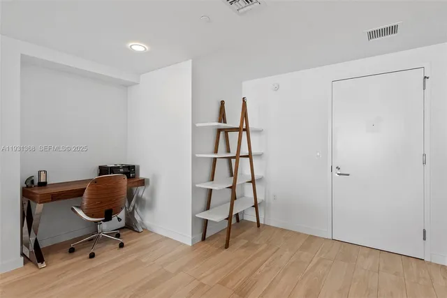 a view of workspace with wooden floor shelves