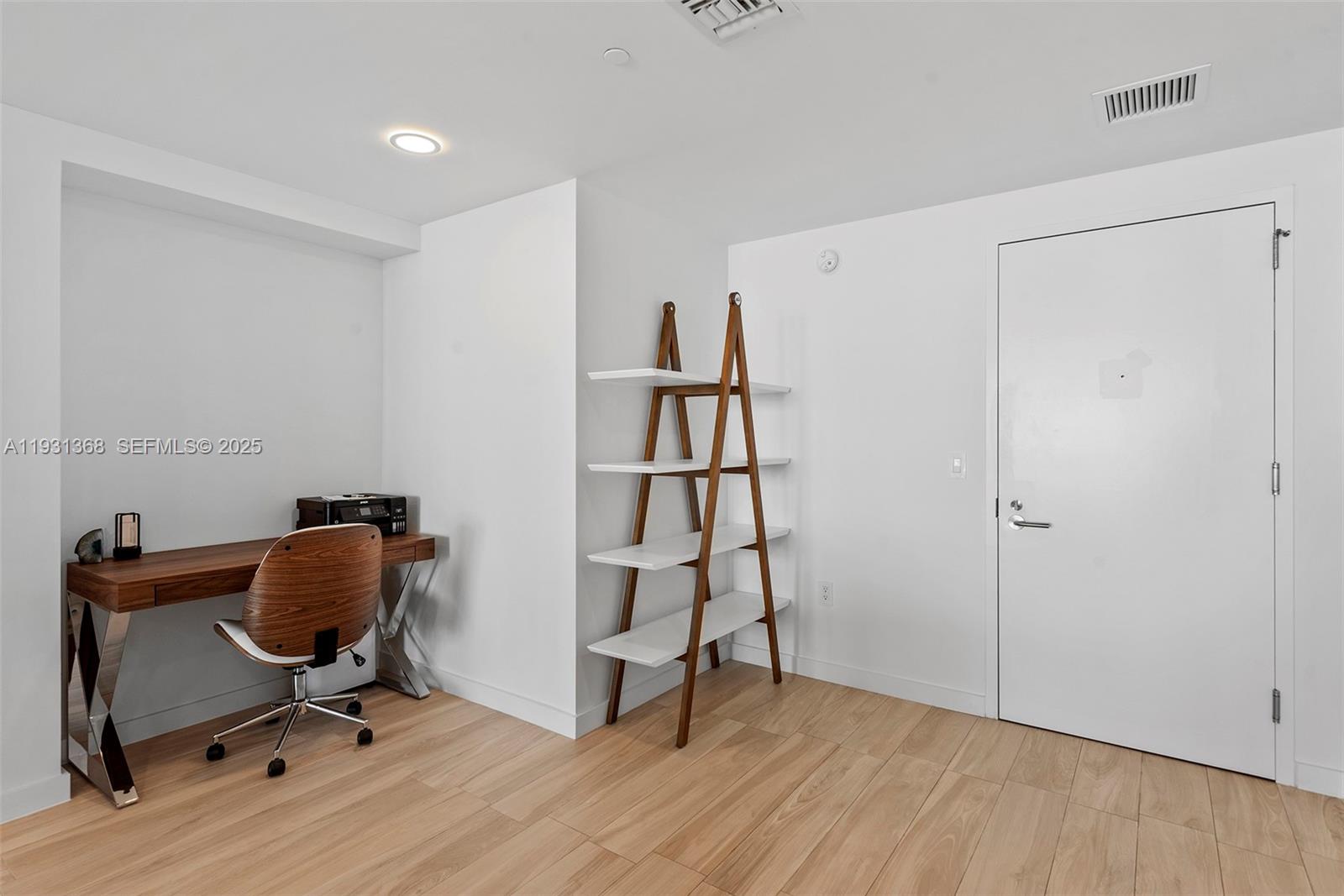 460 Northeast 28th Street, Unit 3903 Miami, FL 33137 - Photo 22 of 44 a view of workspace with wooden floor shelves