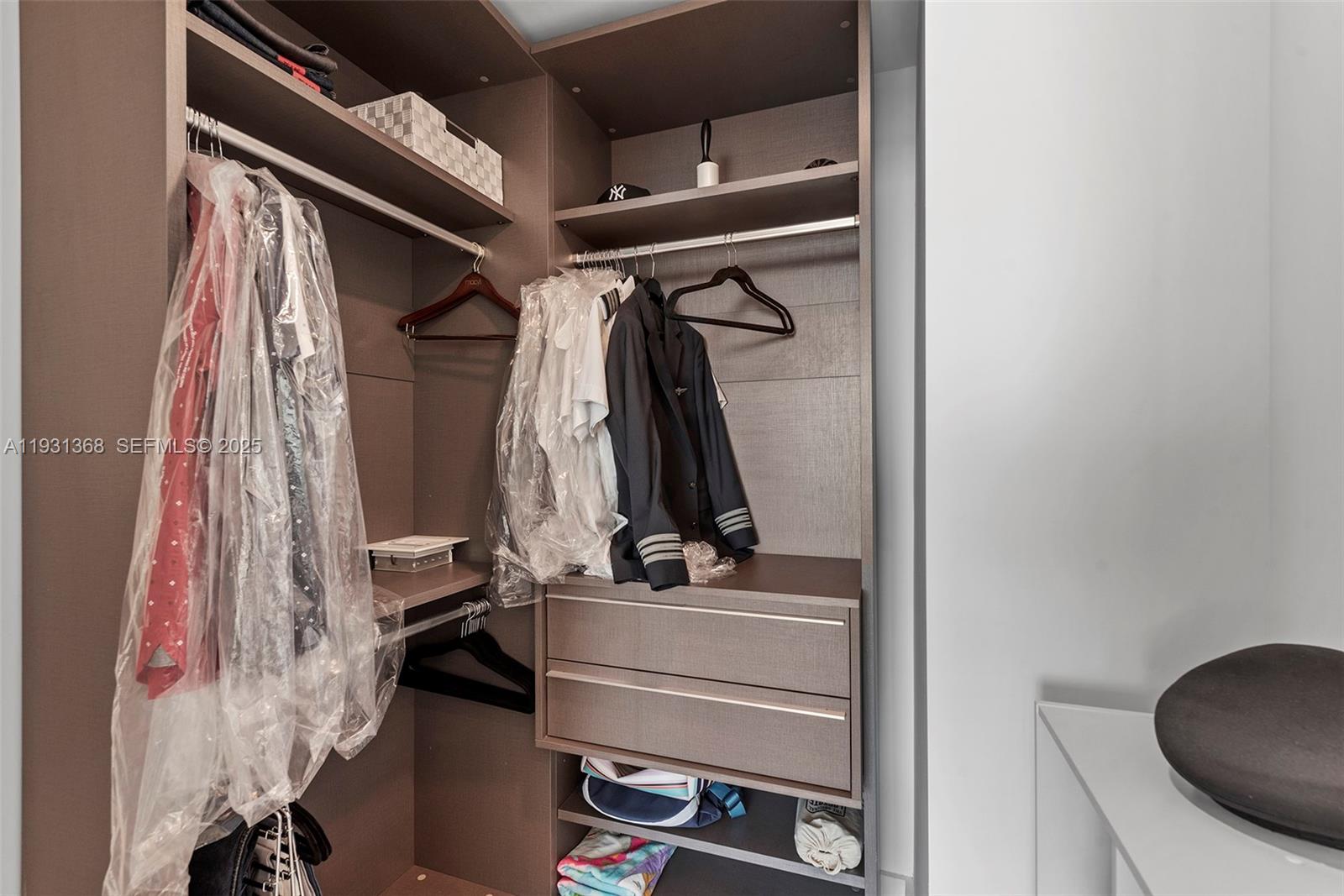 460 Northeast 28th Street, Unit 3903 Miami, FL 33137 - Photo 30 of 44 a view of walk in closet with clothes