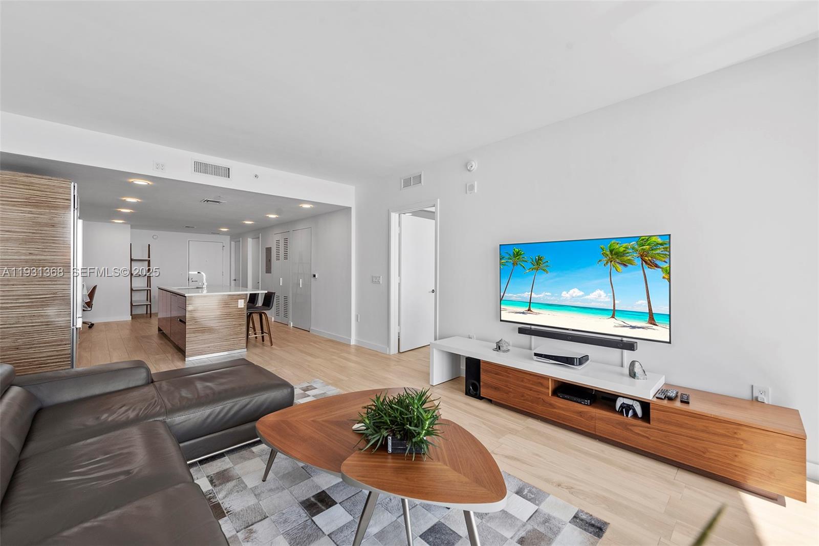 460 Northeast 28th Street, Unit 3903 Miami, FL 33137 - Photo 9 of 44 a living room with furniture pool table and a flat screen tv