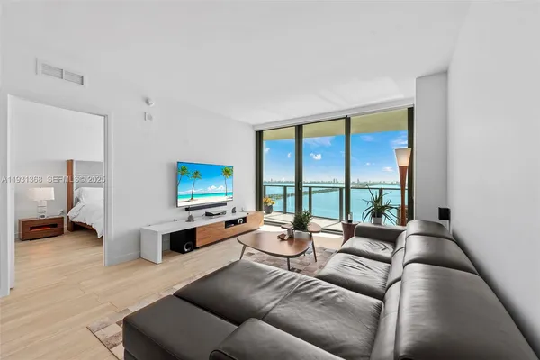 a living room with furniture and a flat screen tv