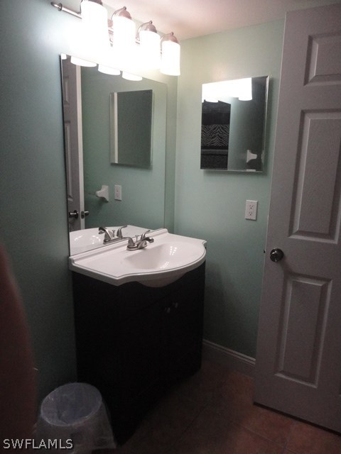 5307 Summerlin Road, Unit 710 Fort Myers, FL 33919 - Photo 12 of 19 a bathroom with a sink and mirror