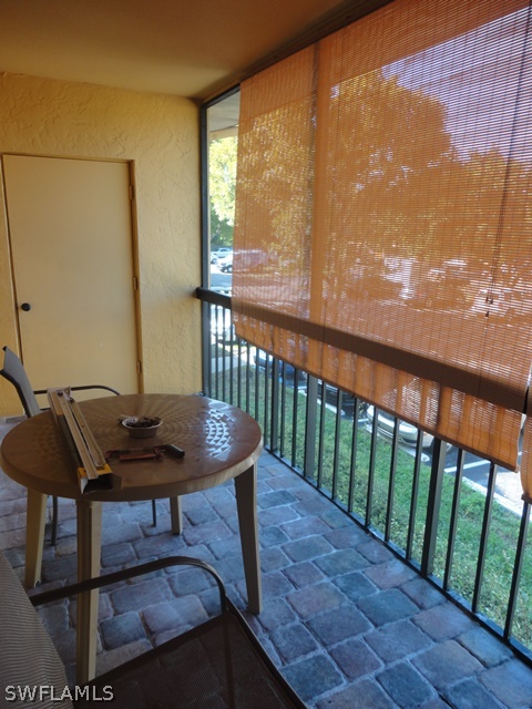 5307 Summerlin Road, Unit 710 Fort Myers, FL 33919 - Photo 13 of 19 a view of a balcony with furniture