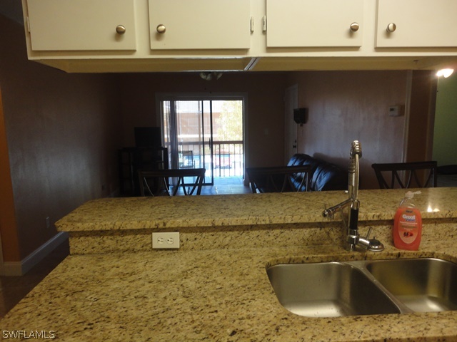 5307 Summerlin Road, Unit 710 Fort Myers, FL 33919 - Photo 3 of 19 a bathroom with a sink and a mirror