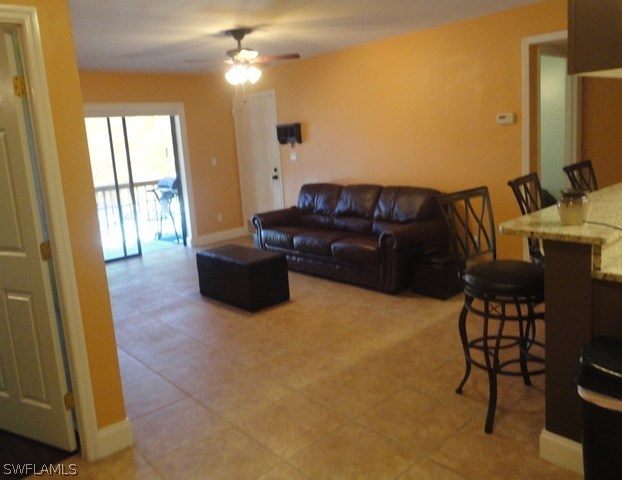 5307 Summerlin Road, Unit 710 Fort Myers, FL 33919 - Photo 4 of 19 a living room with furniture and a flat screen tv