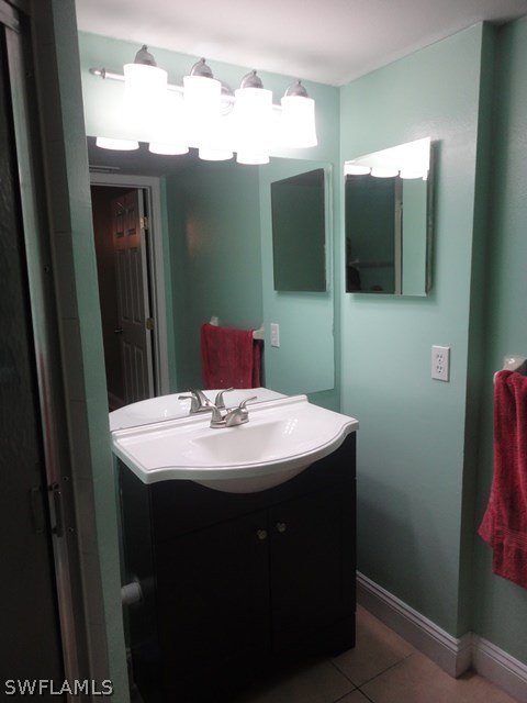 5307 Summerlin Road, Unit 710 Fort Myers, FL 33919 - Photo 8 of 19 a bathroom with a sink and mirror