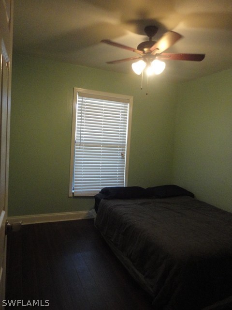 5307 Summerlin Road, Unit 710 Fort Myers, FL 33919 - Photo 10 of 19 a bed sitting in a bedroom next to a window