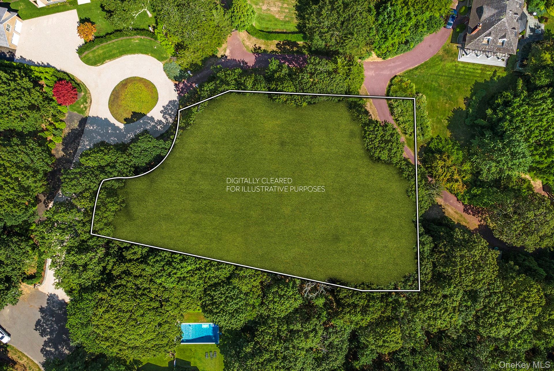 an aerial view of a residential houses with outdoor space and street view