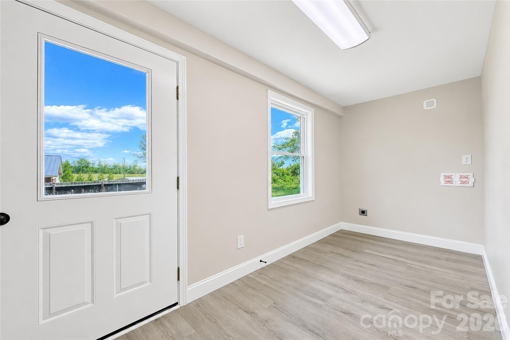 1403 Dudley Shoals Road Granite Falls, NC 28630 - Photo 23 of 34 a view of an empty room with wooden floor and a window