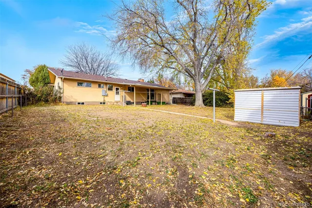 a view of yard with wooden fence