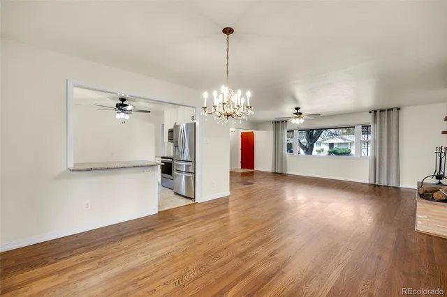 a view of a room with window and wooden floor