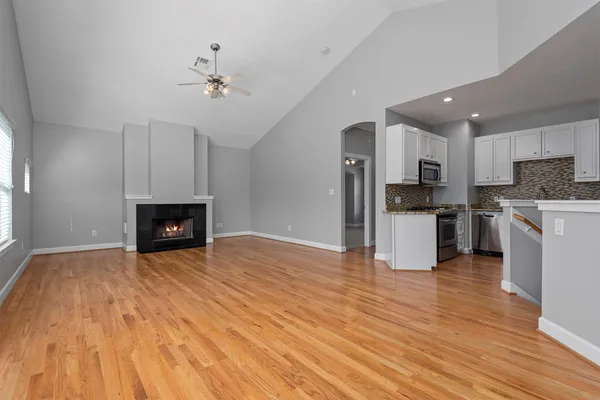 a view of a backyard with wooden fence